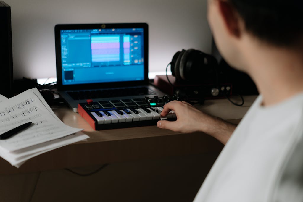 A Person Playing Keyboard Synthesizer